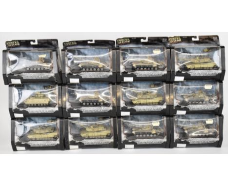 Twelve Unimax Forces of Valour 1:72 scale diecast model tanks to include U.S. M1A2 Abrams, M3A Bradley and Iraqi T-72, all in