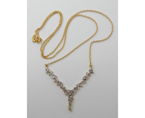 A gold plated silver diamond ice cluster necklace length of chain 46cm, weight 3.7gms Condition Report: Diamonds are not true
