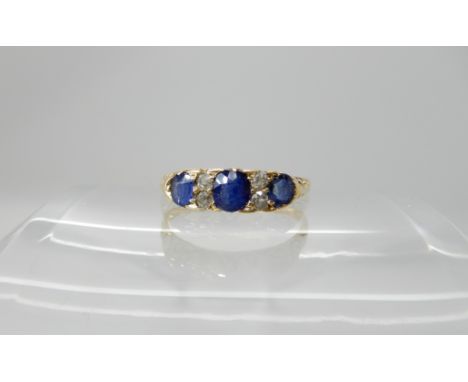 An 18ct gold sapphire and diamond ring with scroll mount, size N, weight 2.4gms Condition Report: Available upon request