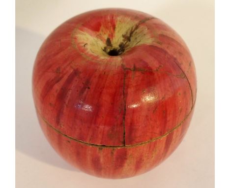An early tea caddy formed a red-painted apple with restoration, 6cm high Condition Report: Available upon request
