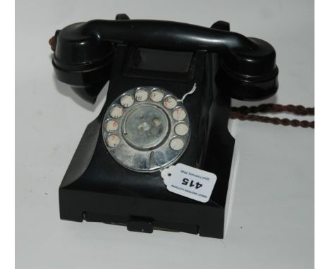 A vintage black Bakelite telephone Condition Report: Available upon request