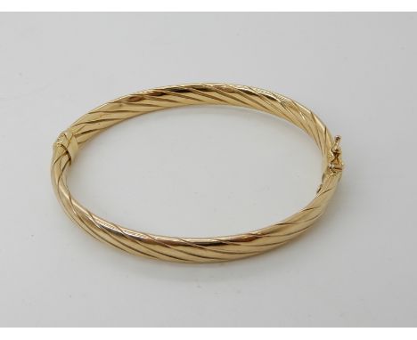A 9ct gold bangle, weight 8gms Condition Report: Available upon request