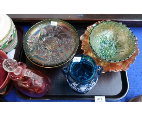Two Carnival glass dishes decorated with stags and holly, other carnival glass, a cranberry flagon and a white enamel painted