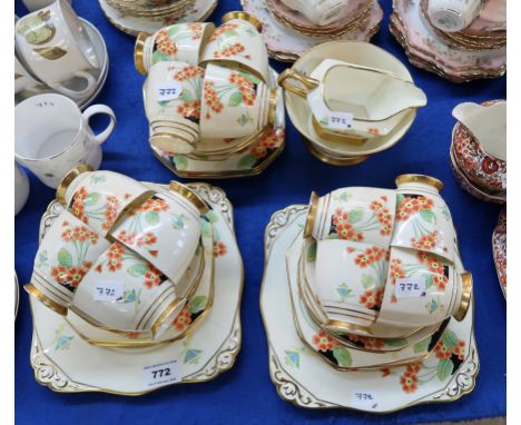 An Art Deco Plant Tuscan china teaset decorated with primroses comprising twelve cups, saucers, plates, two cake plates, milk