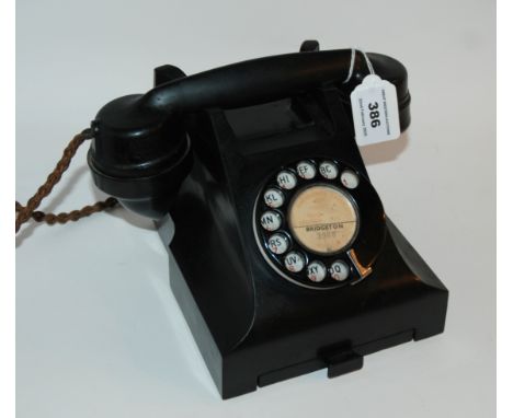 A vintage black Bakelite telephone Condition Report: Available upon request