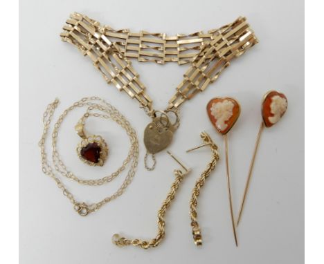 Two 9ct gold shell cameo pins, a 9ct gate bracelet, and a 9ct garnet pendant and chain, weight combined 8.8gms Condition Repo