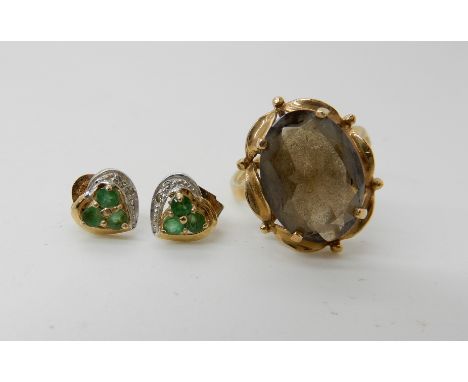 A 9ct gold smoky quartz ring and a pair of emerald and diamond accent earrings, combined weight 4.5gms Condition Report: Avai