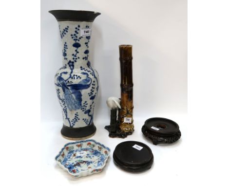 A crackleware blue and white vase decorated with peacocks, a stork and bamboo ceramic vase, a wavy edge dish and two wooden s