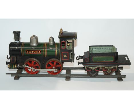 A vintage Bing tinplate clockwork locomotive with tender, two coaches and wagon Condition Report: Available upon request