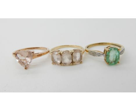 A 9ct gold ring set with a blue gem and diamond accents size O and two set with pink gems both size O, combined weight 5.8gms