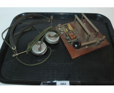 A pair of vintage Canadian Brandes Limited headphones and A.M. marked morse code machine switch, tagged 'Buzzer Practise Ref.