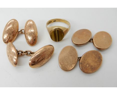 A 9ct gold tiger's eye signet ring size O, a pair of 9ct rose gold monogrammed cufflinks and a further plain pair, combined w