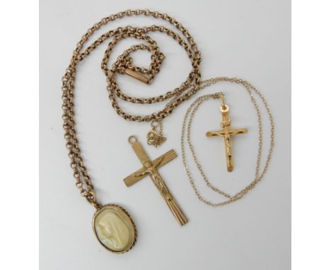Two 9ct gold crucifixes, one with a 9ct chain, a 9ct moulded Mary pendant and vintage 9ct chain, combined weight 10.8gms Cond