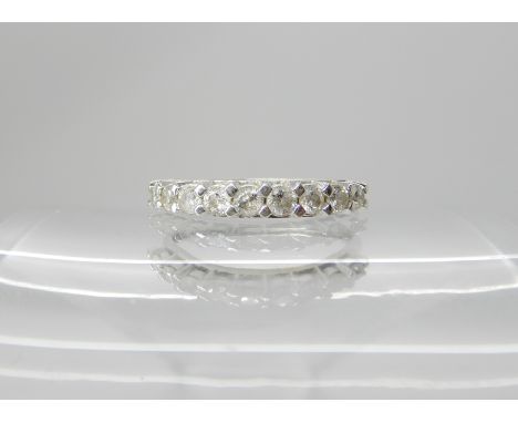 A 9ct white gold diamond set half eternity ring set with estimated approx 0.45cts of brilliant cut diamonds, size O, weight 1