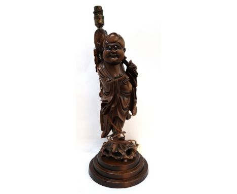 A carved wooden sage table lamp Condition Report: Available upon request