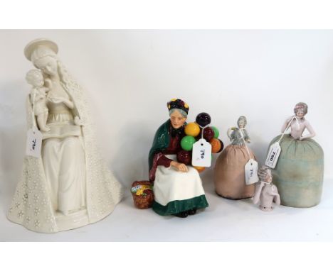 A Goebel Madonna and child, a Royal Doulton Old Balloon Seller and three half dolls Condition Report: Available upon request