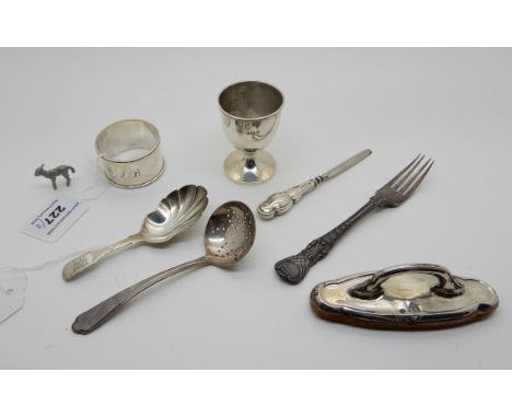 A lot comprising a silver caddy spoon, Exeter 1833, napkin ring egg cup, blotter and sifter ladle with an EP for and a miniat