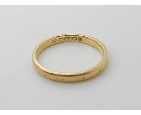 An 18ct gold wedding ring size U, weight 4gms Condition Report: Available upon request