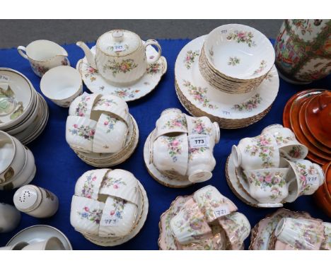 A Royal Albert Moss Rose tea and dinner service comprising eight dinner plates, bowls, cups, saucers and side plates, togethe