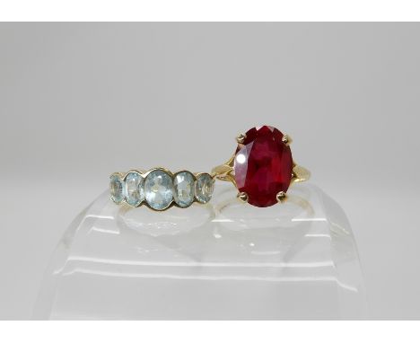 A 9ct gold five aquamarine set ring, size M, together with a 9ct ring set with red glass size M1/2 weight combined 7.3gms Con