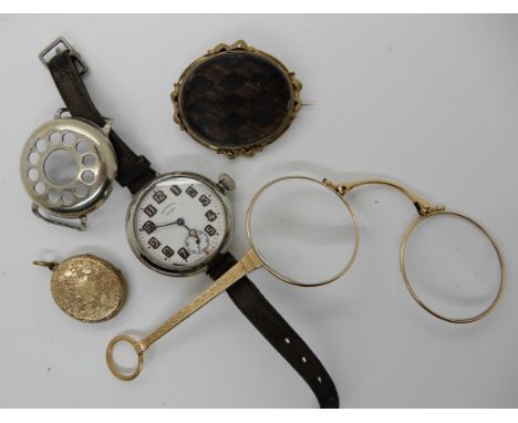 A hair panel mourning brooch, a pair of lorgnettes, an Ingersoll wristwatch and a locket Condition Report: Not available for 