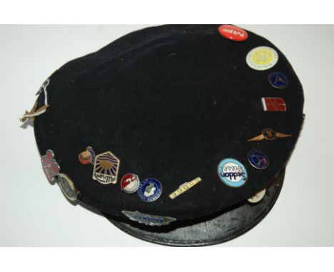 A vintage cap with various enamel and other badges Condition Report: Available upon request
