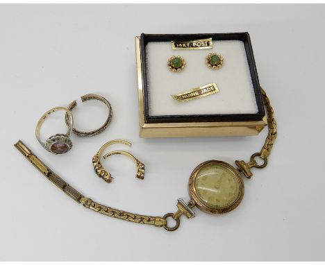 A pair of 14k jade stud earrings, weight 1gm a 18ct gold ring set with green gems (af) weight 4gms and other items Condition 