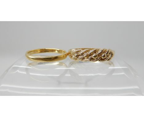 An 18ct gold wedding ring size K, weight 1.8gms and a 9ct gold knot ring size Q1/2, weight 1.8gms Condition Report: Available
