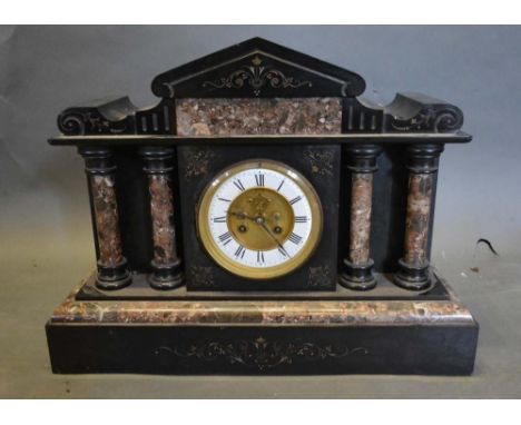 A Victorian Black Slate and Rouge Marble Mounted Mantel Clock, the enamel dial with Roman numerals and visible escapement fla