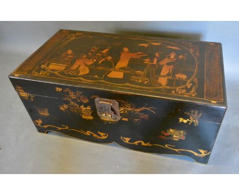 A Japanese Lacquered Rectangular Trunk with a metal escutcheon and side handles, 70cm wide, 40.5cm deep, 34cm tall 
