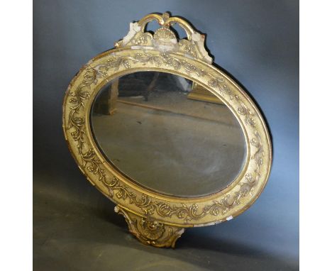 A 19th Century French Gilded Oval Wall Mirror with pierced cresting 80cm high by 74cm wide 