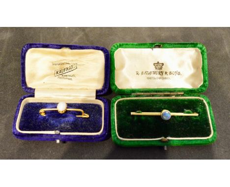 A 15 Carat Gold Bar Brooch set with a circular opal, 2.1 grammes, together with a 9 carat gold bar brooch with oval opal, 2.3