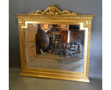 A French Style Gilded Large Overmantel Mirror, with pierced scroll cresting 137cm high by 140cm wide 