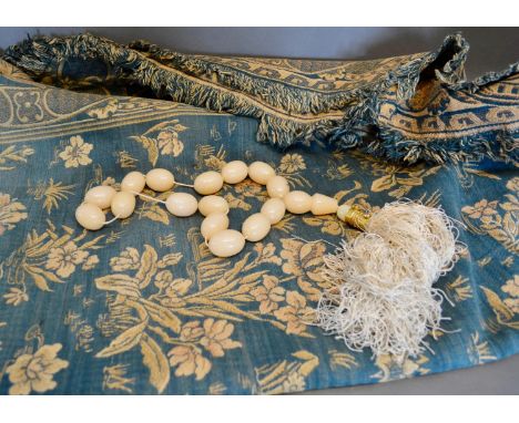 A Tapestry Wall Hanging depicting flowers, together with a bead tie back 