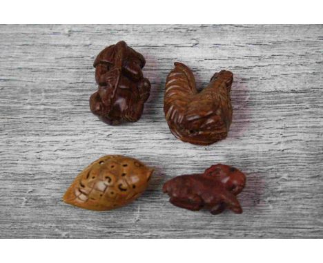 Four miniature wooden netsuke figures to include a fish, goat, hen and monkey