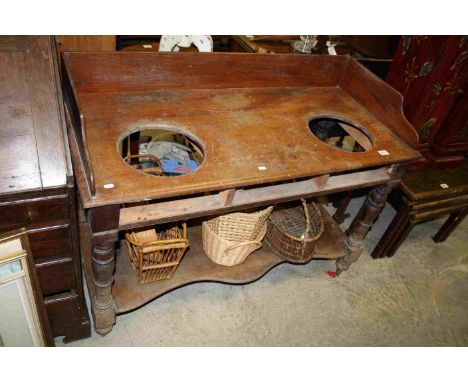 Mid 19th century Mahogany Washstand with Gallery Back, Two Recesses for Washbasins, Shaped Undertier Pot Shelf, raised on tur