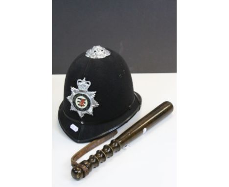 Avon and Somerset constabulary police helmet with a wooden truncheon