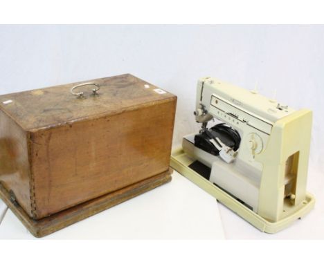 Two vintage Sewing Machines to include a wooden cased example by Frister &amp; Rossmann &amp; an Electric Singer