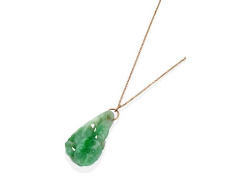 A Jade Pendant, carved to depict a bird and flowerhead, measures 2.5cm by 4.4cm see illustration.  The pendant is in good con