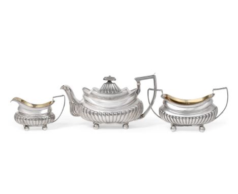 A George III Silver Three Piece Tea Service, Michael Starkey, London 1809/10, rounded rectangular and part fluted, with gadro