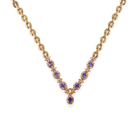 A Tanzanite and Diamond Necklace, six clusters comprising an oval mixed cut tanzanite within a border of round brilliant cut 
