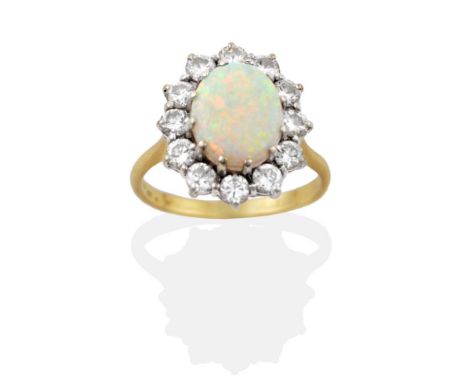 An Opal and Diamond Cluster Ring, an oval cabochon opal in a white claw setting, within a border of round brilliant cut diamo