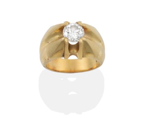 A Diamond Solitaire Ring, the round brilliant cut diamond in a yellow extended four claw setting to an angular tapering shank