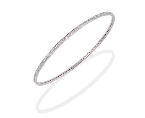 An 18 Carat White Gold Diamond Bangle, inset throughout with round brilliant cut diamonds, total estimated diamond weight 1.2