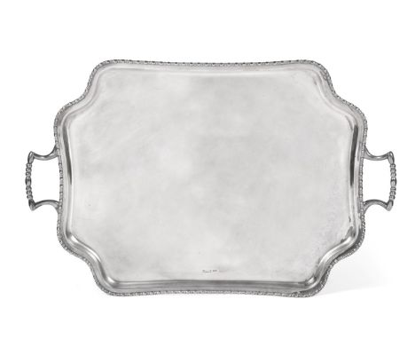 A Twin-Handled Silver Tray, Atkin Bros, Sheffield 1910, shaped rectangular with beaded rim, on four button feet, 60cm wide ov