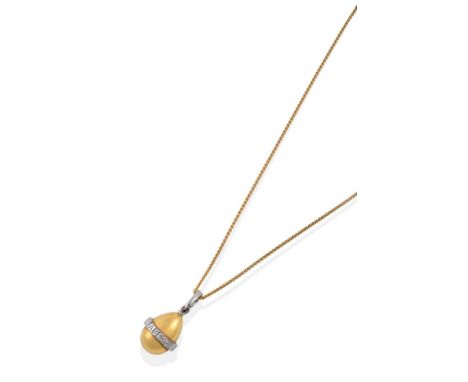 An 18 Carat Gold Egg Pendant on Chain, by Fabergé, the plain polished egg with a white band across the centre stamped 'FABERG