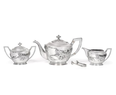 A Chinese Export Silver Four Piece Tea Service, maker's mark KH, Hong Kong, 1st half 20th century, of oval form, decorated in