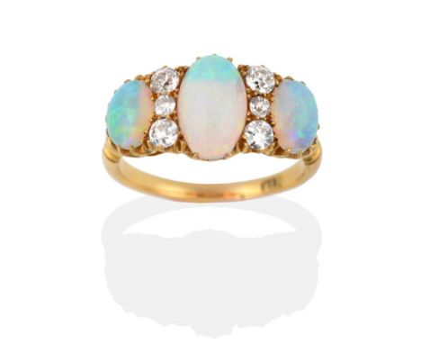 A Late 19th Century Opal and Diamond Ring, three graduated oval cabochon opals spaced by vertically set trios of old cut diam