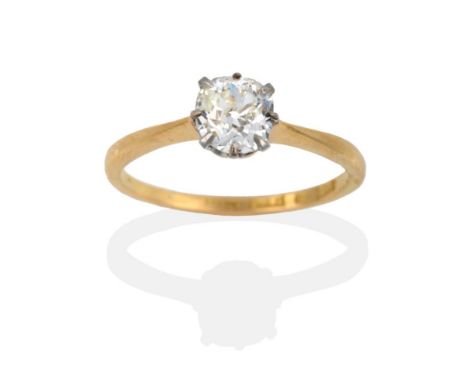 A Diamond Solitaire Ring, the old mine cut diamond within white claws on a yellow tapered shoulder plain polished shank, tota