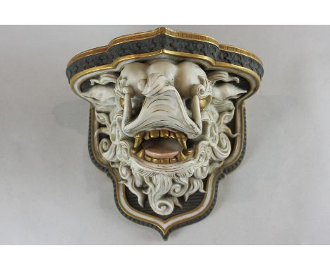 A Royal Worcester porcelain wall bracket in the form of a Chinese lion, 23cm  (a/f) (NC)